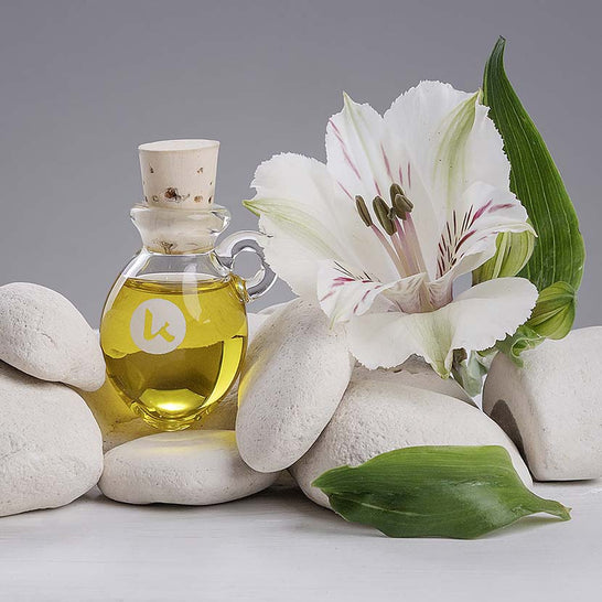 Cold-pressed hypoallergenic jojoba oil in a hand-blown amphora