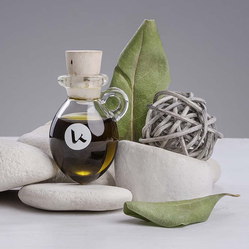 Pure, cold-pressed Henna oil in a hand-blown small glass amphora