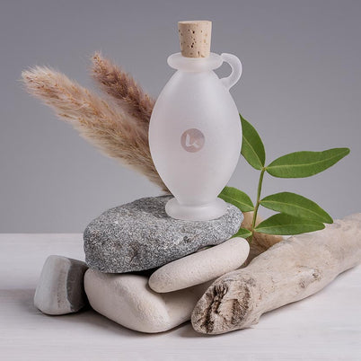 Frosted glass bottle in a hand-blown amphora style with cork closures