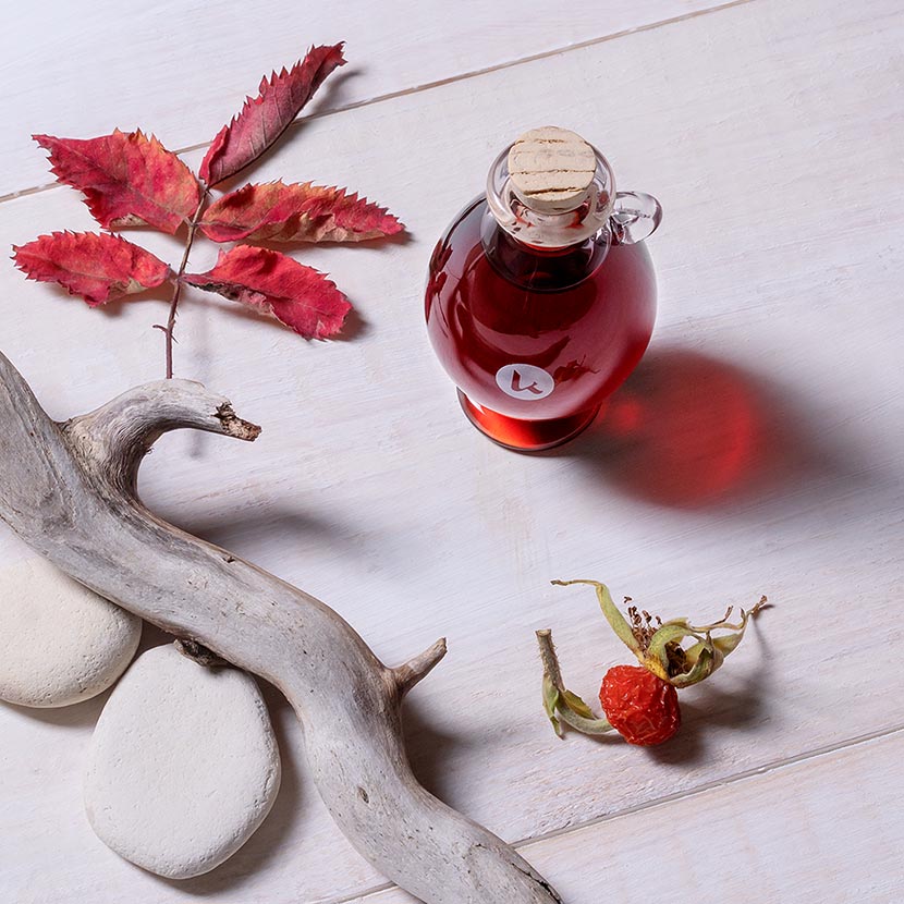 Pure, cold-pressed rosehip oil in a hand-blown glass amphora - top view